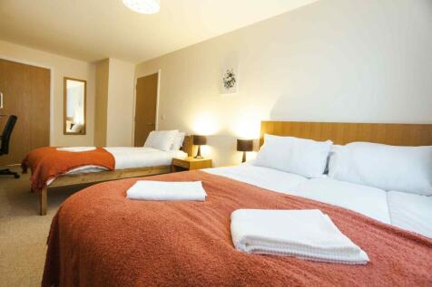 Bright and inviting double bedroom featuring tw...
