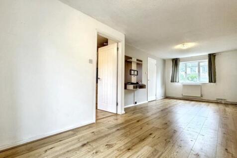 Bright and spacious living room featuring conte...
