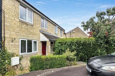 A charming front view of a traditional terraced...