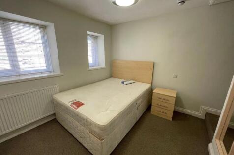 Bright and tidy double bedroom featuring a comf...