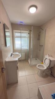 A clean and modern bathroom featuring a spaciou...