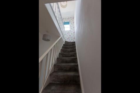 A staircase leading to the upper floor, featuri...