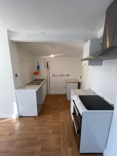 Bright and functional kitchen space featuring m...
