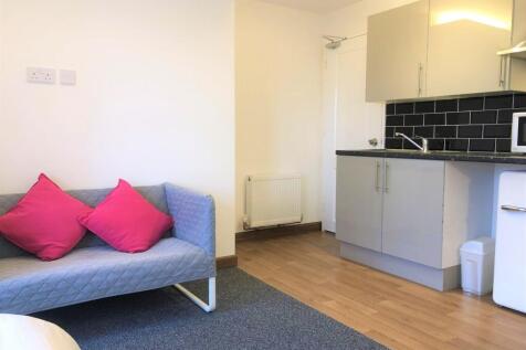 Bright and tidy living area featuring a modern ...