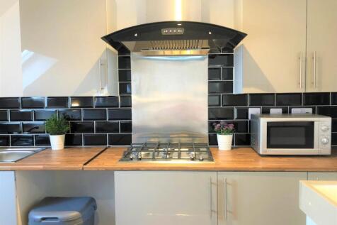Modern kitchen area featuring a sleek gas hob w...