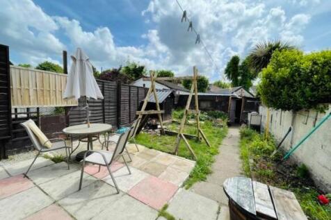 A bright and inviting garden space featuring a ...