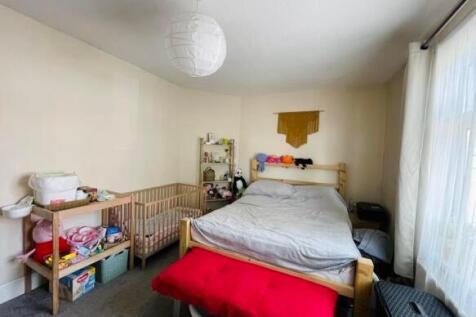 A cozy double bedroom featuring a comfortable d...