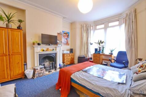 Bright and spacious master bedroom featuring a ...