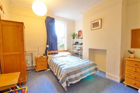 Bright and cozy double bedroom featuring a comf...