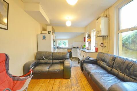 A cozy living room featuring comfortable leathe...
