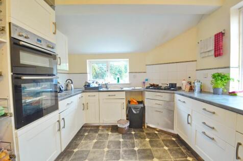 Bright and functional kitchen featuring ample c...