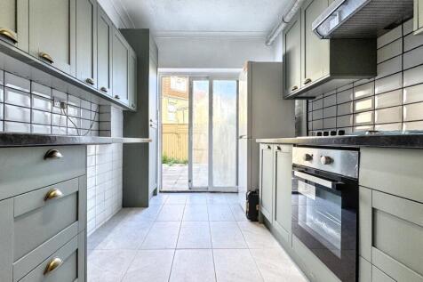 Bright and modern kitchen featuring sleek grey ...