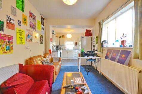 Bright and inviting living room featuring large...