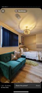 A stylish double bedroom featuring a cozy doubl...