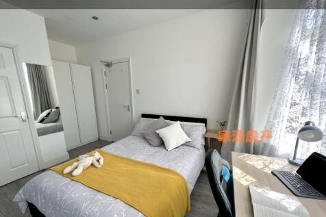 Bright and cozy double bedroom featuring a comf...