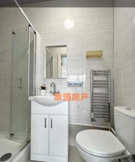 Bright and modern bathroom suite featuring a cl...