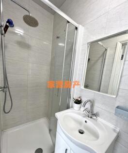 A modern, well-maintained bathroom featuring a ...