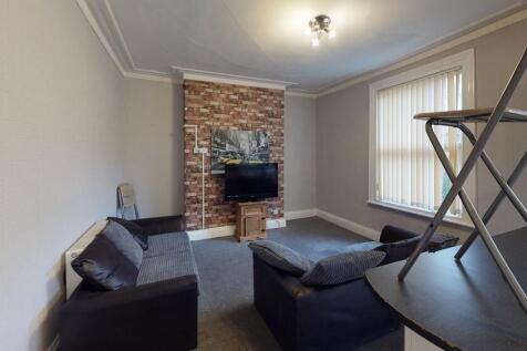 A cozy living room featuring a stylish exposed ...