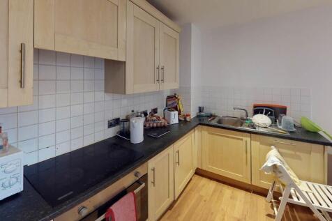A compact, well-maintained kitchen featuring li...