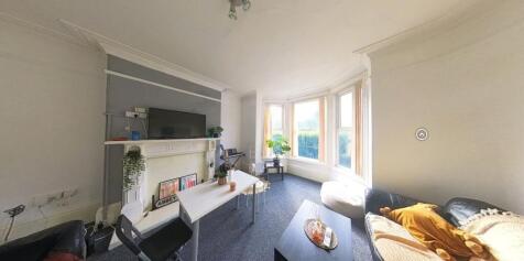 A bright and inviting living room featuring a l...