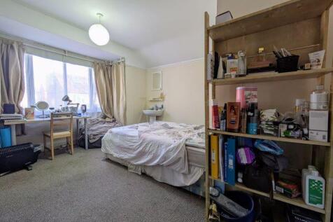 Bright and spacious master bedroom featuring a ...