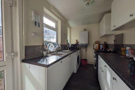 Bright and practical kitchen featuring modern w...