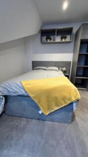 A modern double bedroom featuring a comfortable...
