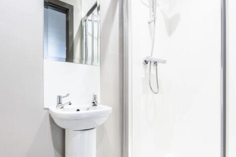 Bright and neat bathroom featuring a modern ped...