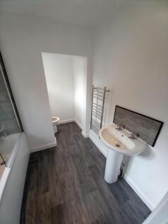 A modern and well-maintained bathroom suite fea...