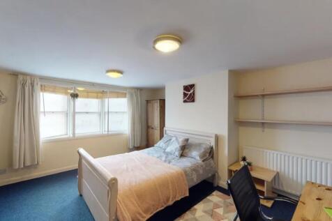 Bright and cozy double bedroom featuring a comf...