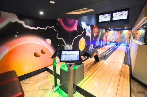 Vibrant and modern bowling alley room with colo...