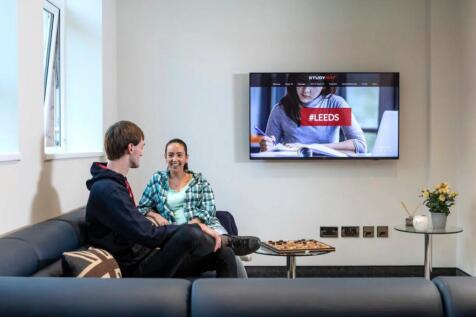 Bright and modern communal lounge featuring com...