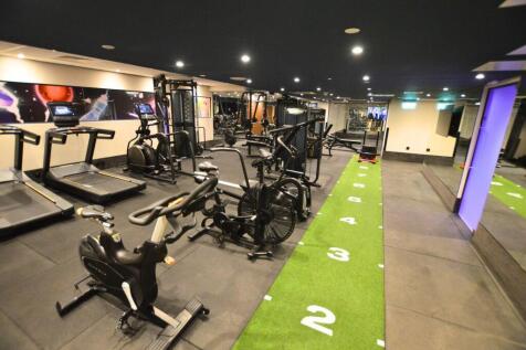 Modern gym featuring a variety of high-quality ...
