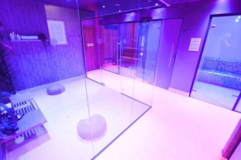 A modern gym space featuring a clean, sleek des...
