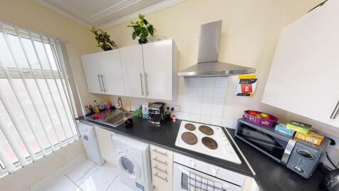 Bright and practical kitchen space featuring mo...
