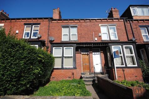 A charming terraced house with a neat front gar...