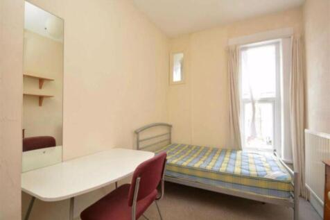A cozy single bedroom with ample natural light ...