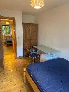 A bright and inviting double bedroom featuring ...