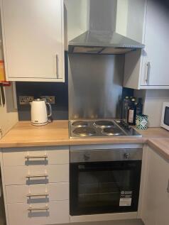 A modern and tidy kitchenette featuring essenti...