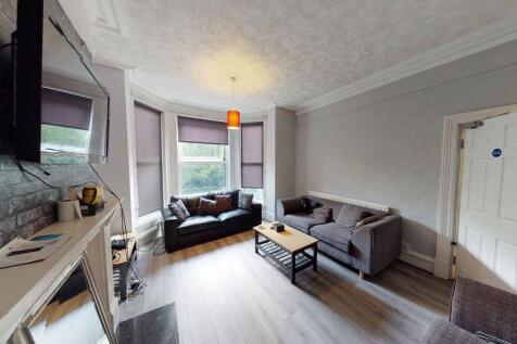 A contemporary living room with a comfortable s...