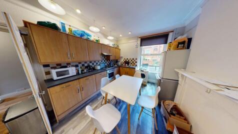 A bright and functional kitchen featuring ample...
