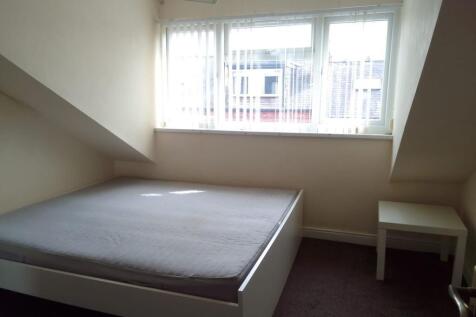 Bright and tidy double bedroom featuring a larg...