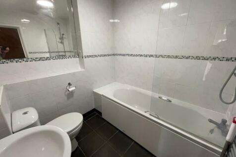 Bright and clean bathroom featuring a full-size...