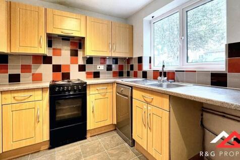 Bright and well-maintained kitchen featuring am...