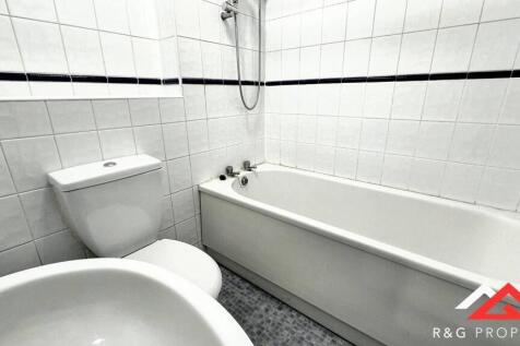 Bright and clean bathroom featuring a classic w...