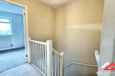 Bright and clean hallway space with light-color...