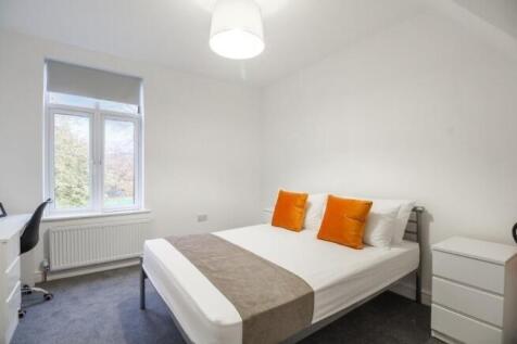 Bright and cozy double bedroom featuring a comf...