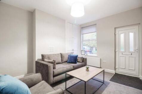 A cozy and inviting living room featuring a neu...