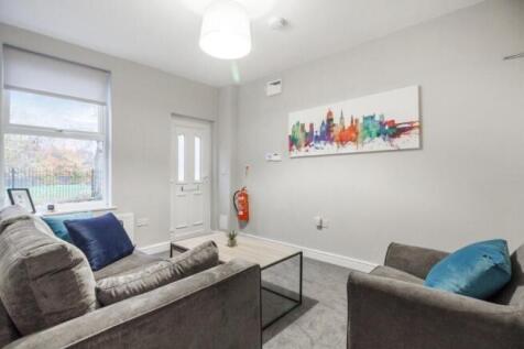 A cozy and well-maintained living room featurin...