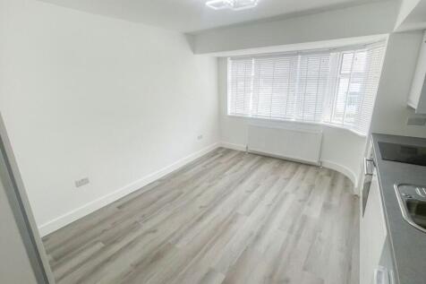 Bright and modern kitchen area with light wood ...